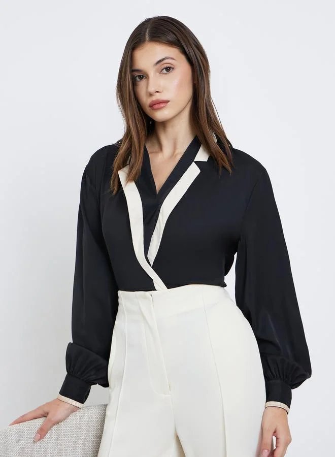 بلوزة بأكمام بالون بنمط لف